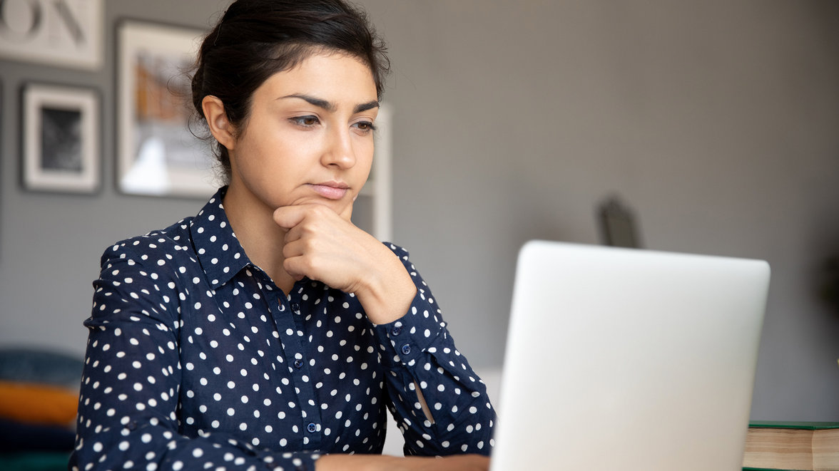 man looking at the ipad screen